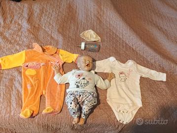 bambola neonato con vestiti e biberon