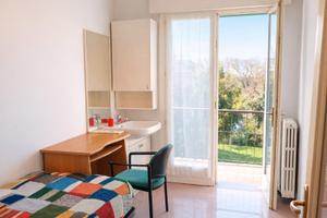 Stanza singola con terrazzo e lavandino