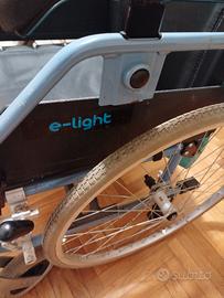 sedia a rotelle e light