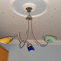 Lampadario in acciaio cromato a tre braccia