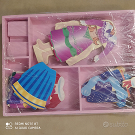 Bambole di legno calamitate