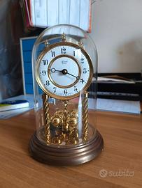 orologio antico a pendolo rotante