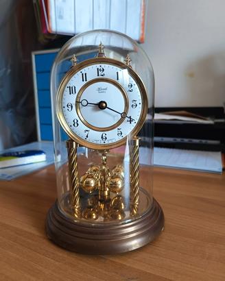 orologio antico a pendolo rotante