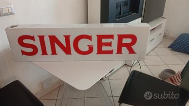 insegna luminosa Singer 
