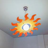 Lampadario a forma di sole