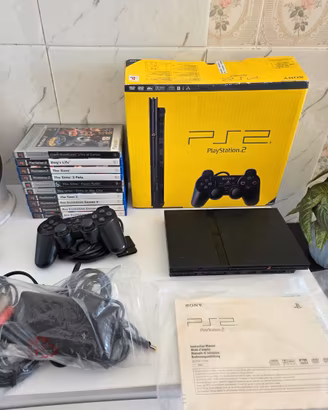 Playstation 2 slim boxata + cavi + 10 giochi 