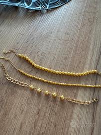 Bracciali con sfere in oro