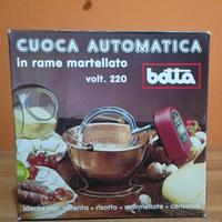 Paiolo di rame con mescolatore