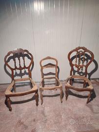 Tris di sedie antiche in legno intagliato