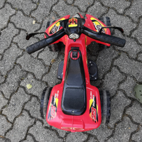 Quad Raptor rosso, con acceleratore a pedale
