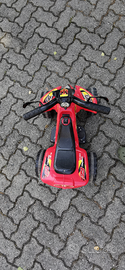 Quad Raptor rosso, con acceleratore a pedale