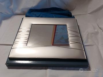 Grande cornice con specchio in lamina di argento