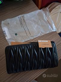 prezzo ribassato!capiente borsello carpisa nuovo