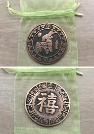 Moneta cinese  ottone zodiaco,anno Capra +custodia
