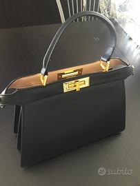 Borsa con dustbag in pelle a mano e tracolla