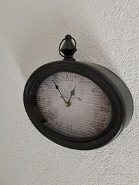 Orologio ovale nero e bianco 