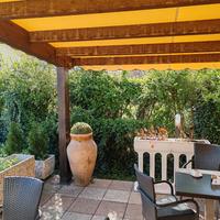 Tettoia in legno con telo PVC