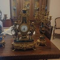 trittico orologio più candelieri 
