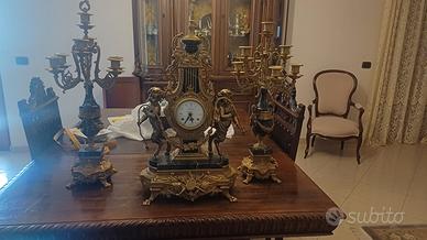 trittico orologio più candelieri 