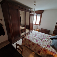 Camera con spazi comuni