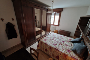 Camera con spazi comuni