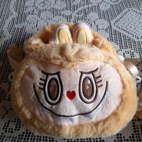 borsetta in finta pelliccia gialla mostri