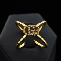 ANELLO GUCCI RUNNING G-CROSS CON DIAMANTI 0.10CT