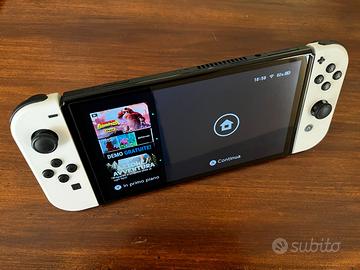 Nintendo Switch OLED + custodia tomtoc