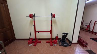 Rack squat con bilanciere pesi