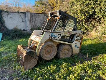 Bobcat 553 + benne