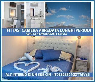 Camera attrezzata con bagno e frigo