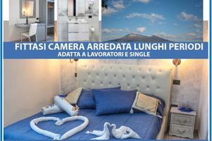 Camera attrezzata con bagno e frigo