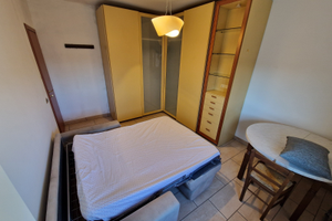 Camera con spazi comuni