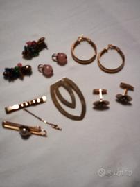 collezione di fermacravatte orecchini gemelli