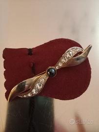 Spilla vintage  con  cabochon nero placcata oro
