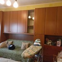 Camera a ponte, divano e scrivania 