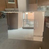 Specchio a parete con illuminazione con anta