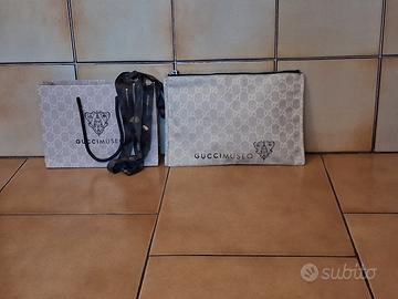 busta/pochette in tela GG di Gucci Museo marrone b