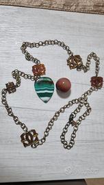 Lotto bijoux collana Guess e pietre ambra