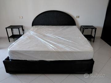 Camera da letto nera in rattan