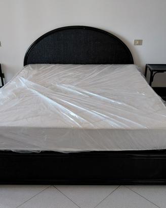 Camera da letto nera in rattan