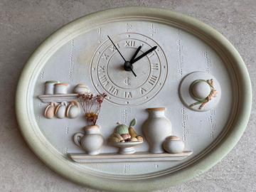 Orologio a parete in ceramica soggetti in rilievo