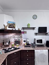 Parete attrezzata piu cucina