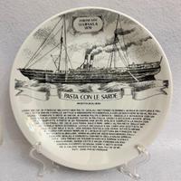 Piatto in porcellana Fornasetti