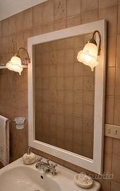 Specchio con lampade 