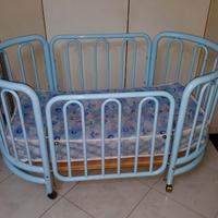 Culla fotma ovale in ferro battuto