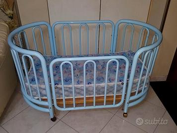 Culla fotma ovale in ferro battuto