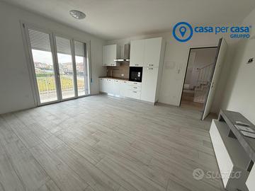 Bilocale con giardinetto e garage