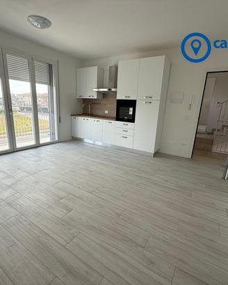 Bilocale con giardinetto e garage