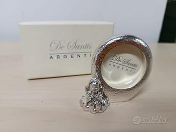 Cornice placcata in argento con angioletto